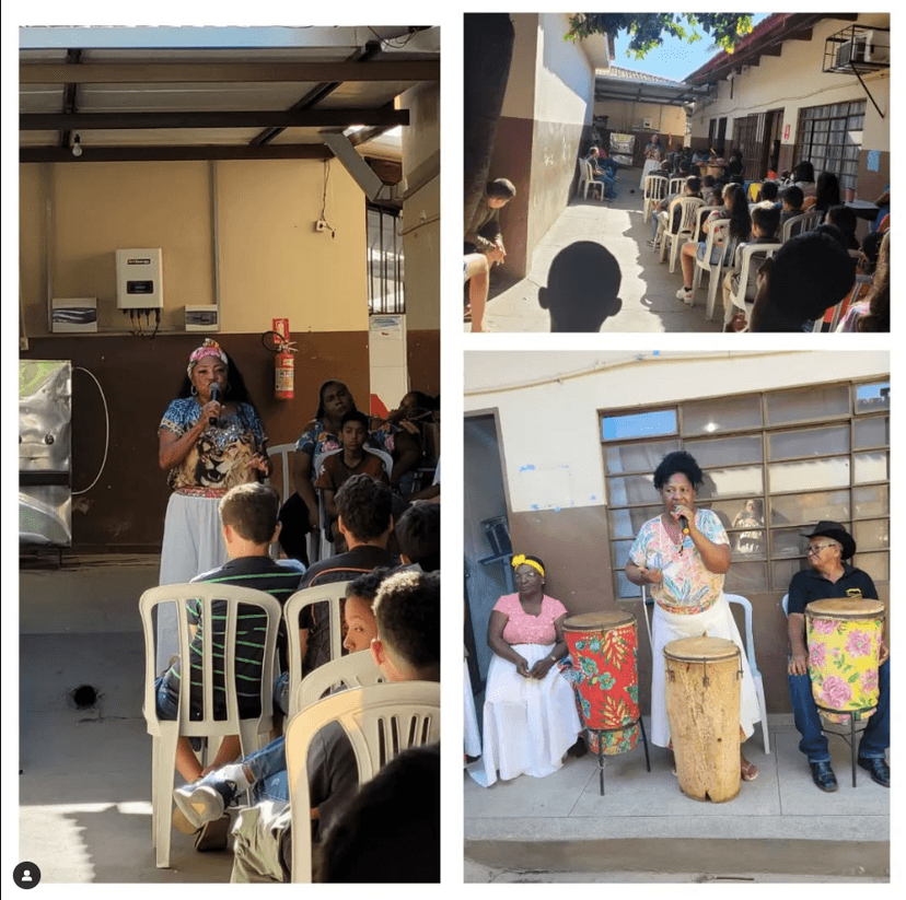 Evento de fomento à cultura afro-brasileira nas escolas. Domingas Quilombola com um microfone fazendo o seu discurso de empoderamento da cultura afro-brasileira.